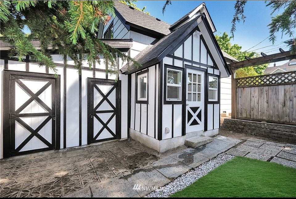 Partially fenced backyard with a well-maintained lawn. Perfect private outdoor space for relaxation.