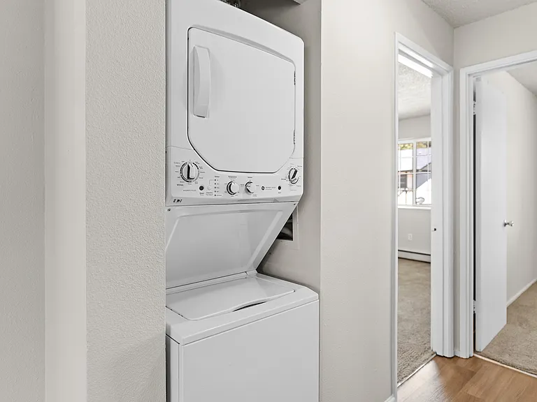Enjoy the convenience of an in-home laundry setup, seamlessly integrated into the hallway. Enjoy the convenience of an in-home laundry setup, seamlessly integrated into the hallway.