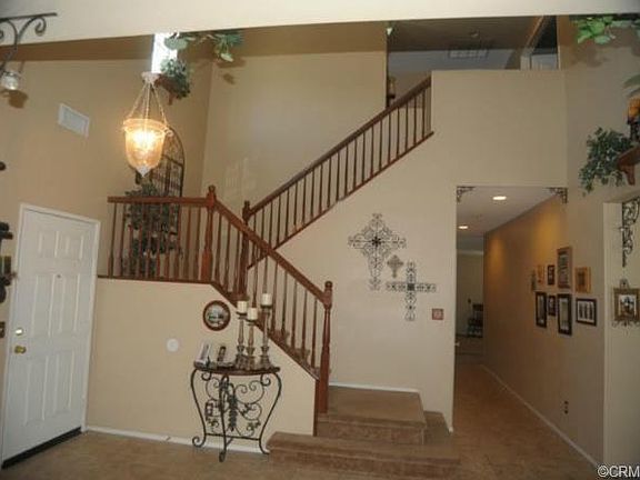 Entry door on the left & hallway leading to the family room on t