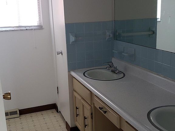 Upstairs bathroom with dual vanity.