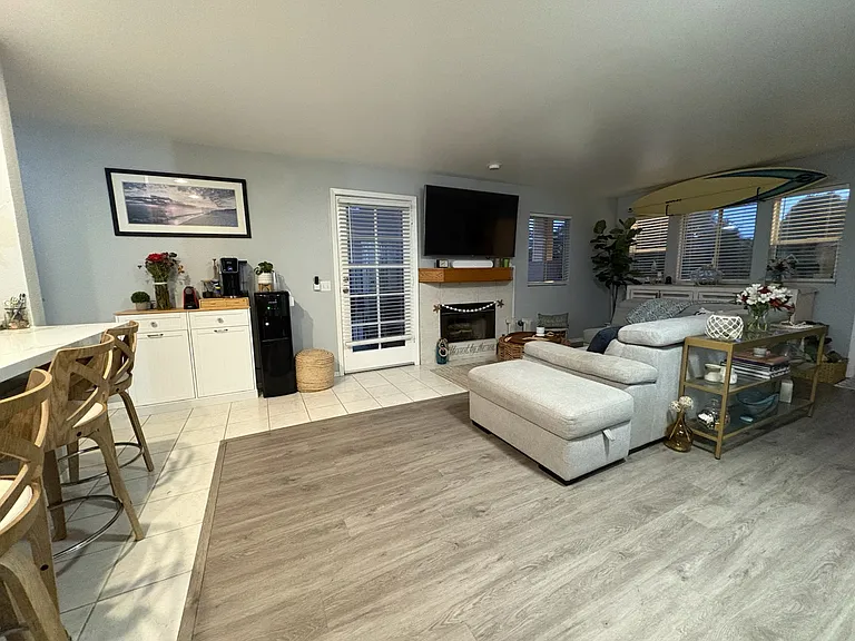 Furnished livingroom and side patio entrance