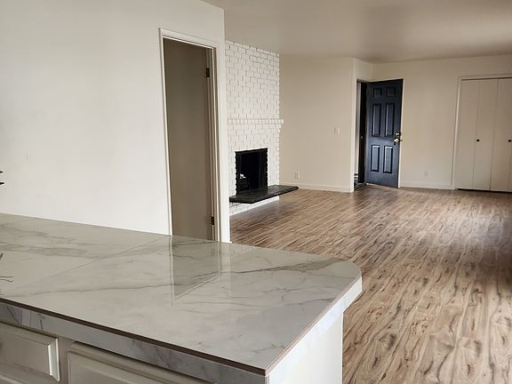 Kitchen looking towards dining area, living room and entry. Nice eastern exposure.