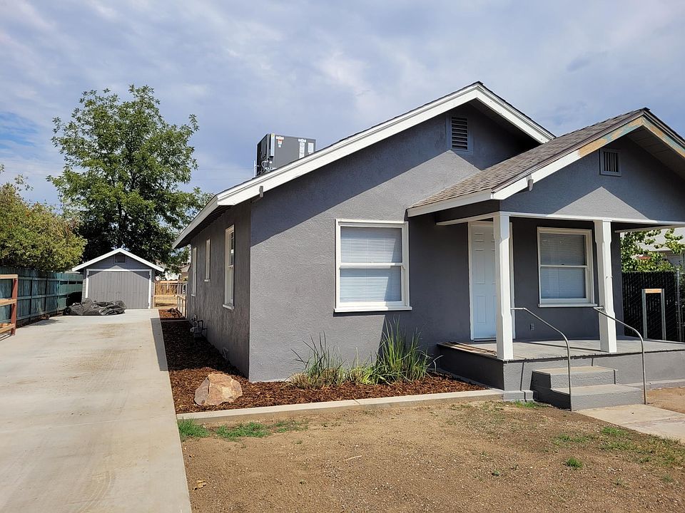 Exterior - front of house with garage set back on left.