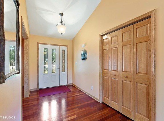 Gleaming Brazilian Cherry Wood floors and a foyer closet!