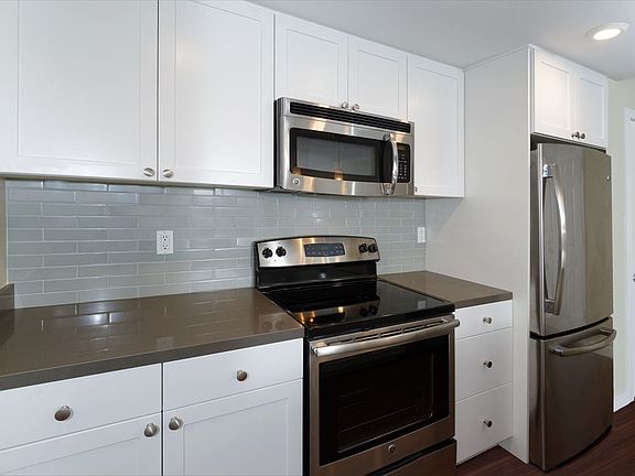 Kitchens With Quartz Countertops Tile Back Splash And Stainless Steel Appliances