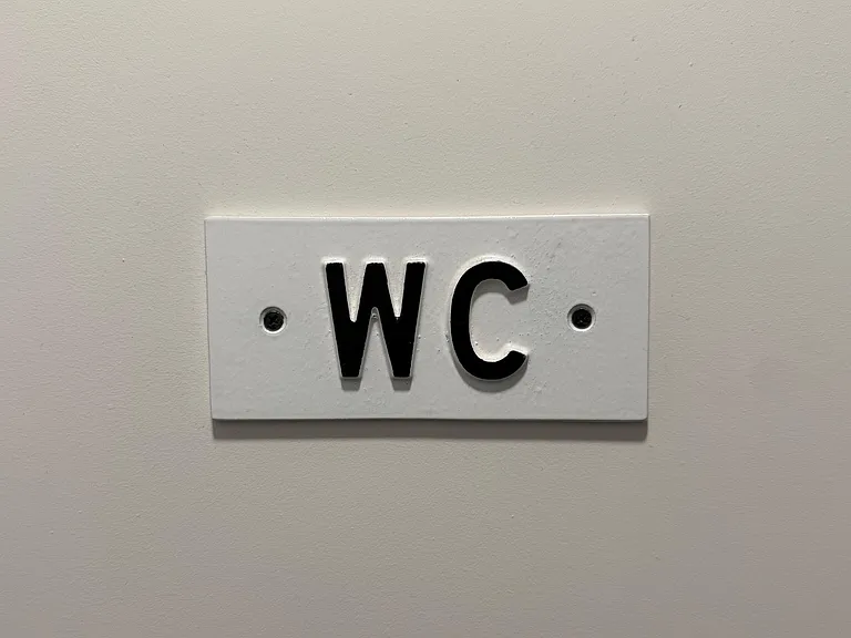 Door to "water closet" a.k.a. bathroom.