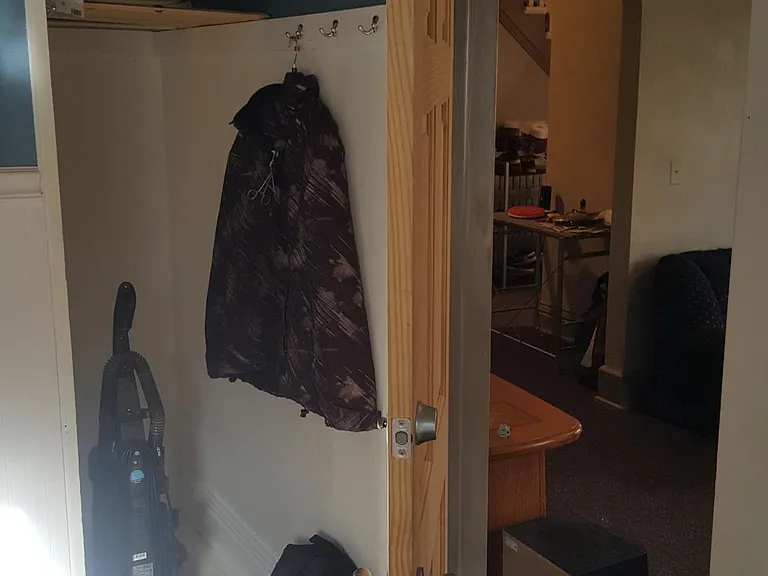 Main floor bedroom closet and door opens in to living room