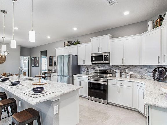 Your well-appointed kitchen provides plenty of cabinet and counter space - Waylyn by Highland Homes