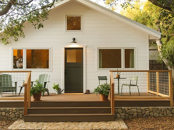 200sf furnished deck. Furnishings include: Two Loll Adirondack chairs, one Loll side table, Houe of Denmark bistro table and chairs and two little Olives in terracotta pots.