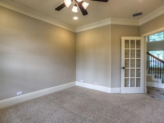 Private and quiet study with French doors off of entry.