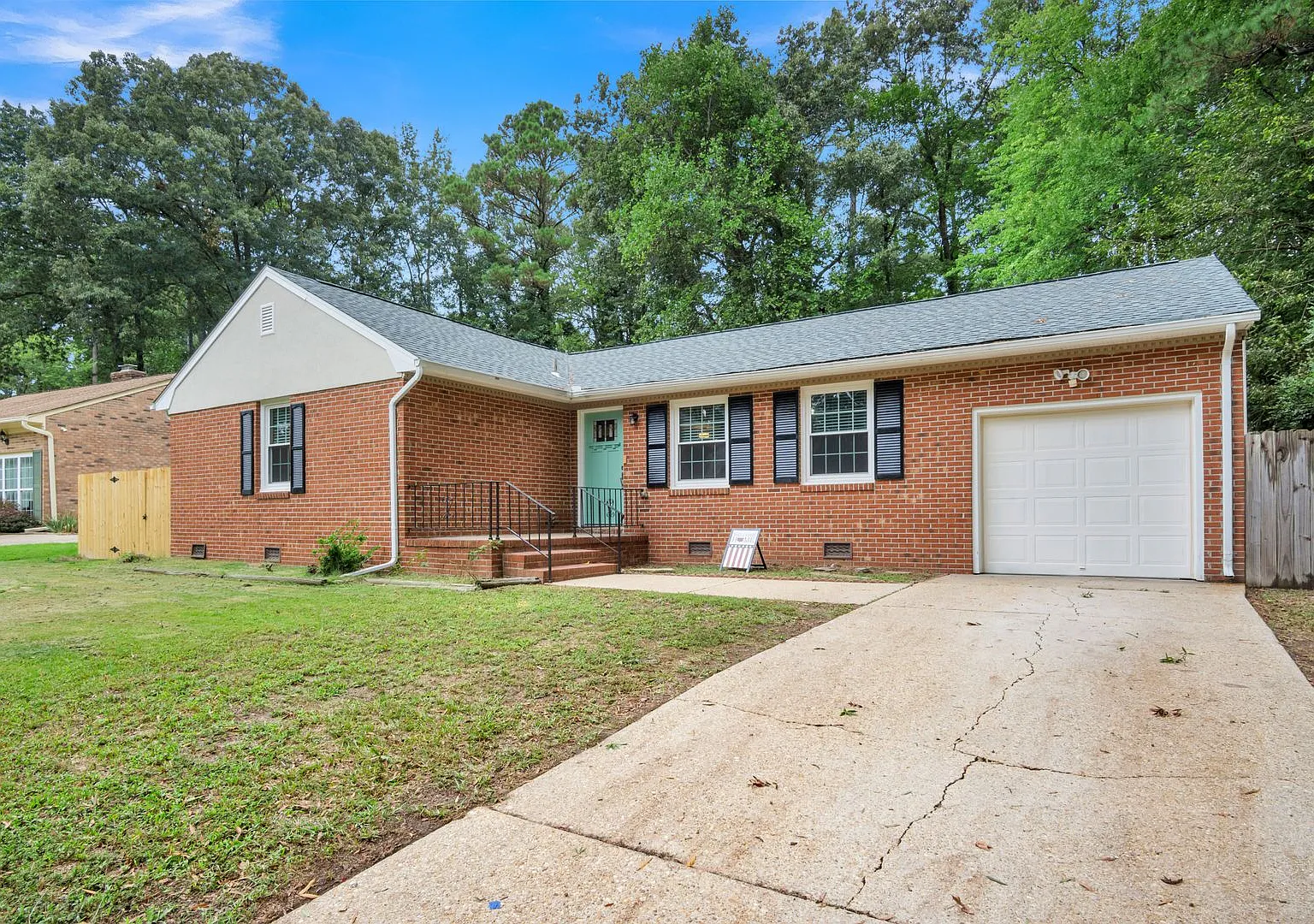 Fully Updated Brick Rancher with Huge Fenced Yard Walk to Outlets! — Photo 2
