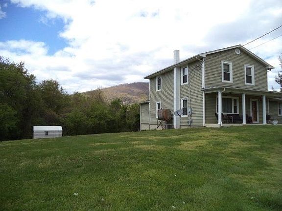 Front and side with storage shed