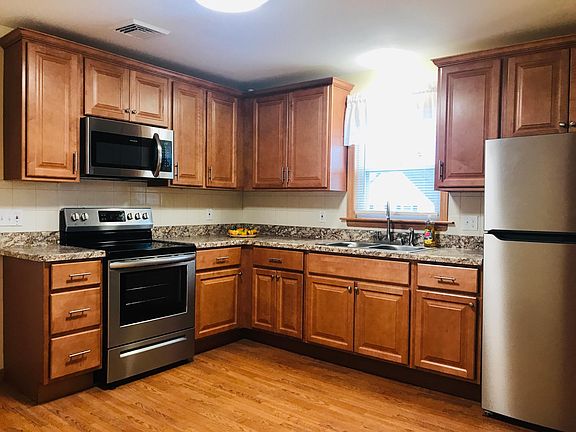 Brand new kitchen - new countertops, cabinets, backsplash, flooring and appliances.