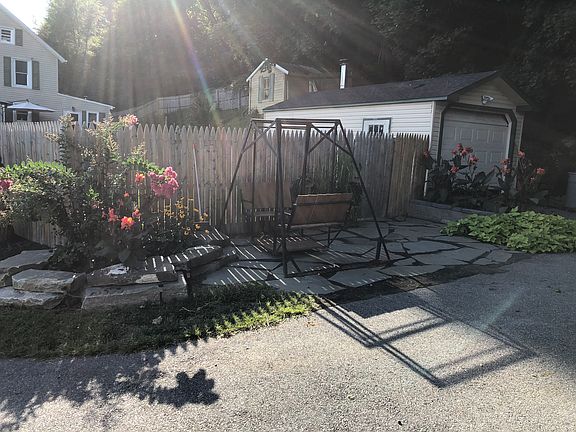 Driveway and fenced yard