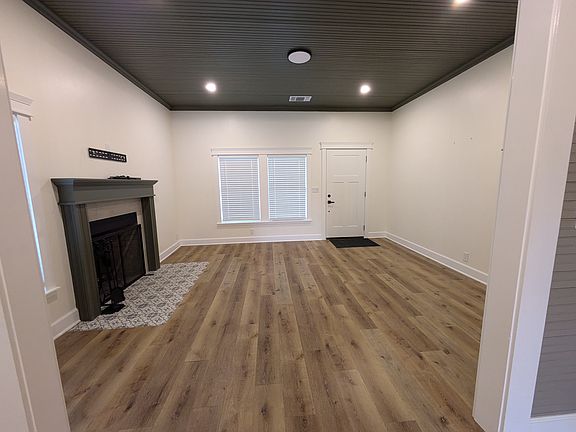 Entry room, living room, fireplace.