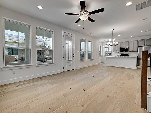 View from office of the main room leftward from living through dining to kitchen.