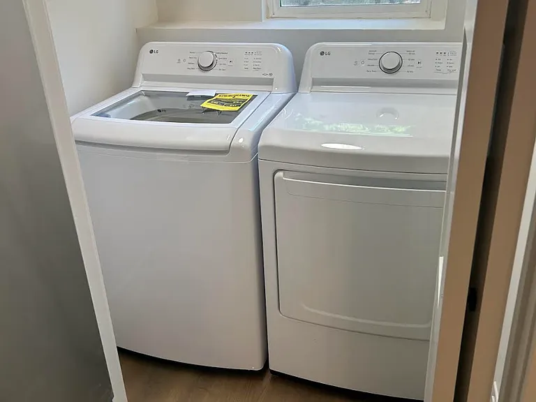 Laundry room with brand new washer & dryer