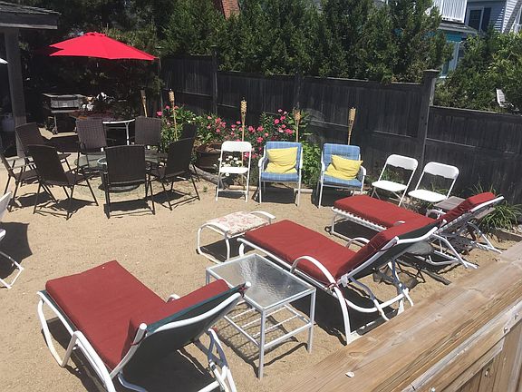 Your beachfront sitting and BBQ area steps from your back door