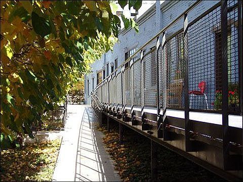 Gated community has beautiful landscaping and community garden plots