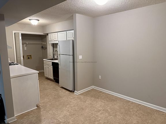 Breakfast nook / kitchen. The washer && dryer hookups are in the back of the kitchen area.