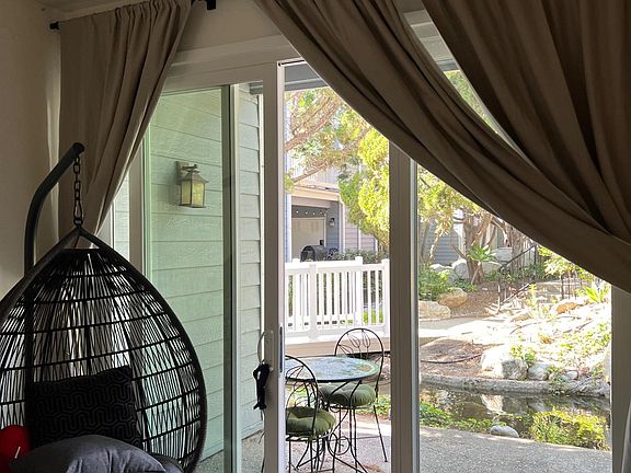 Living room view fireplace and patio view