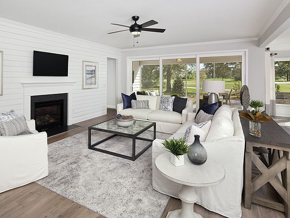 Spacious Gathering Room with optional fireplace, ship lap trim feature, and lots of light.- Model R