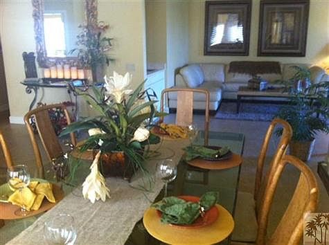 View from dining room area into entrance and living room.  Lots of light, plenty of space to entertain and enjoy.