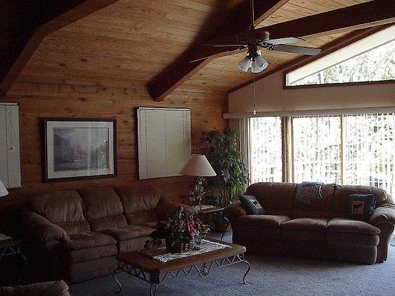 Living room with wall of windows to the view