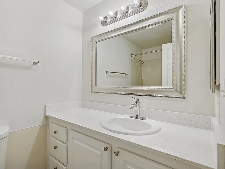 Classic Package III bath with laminate countertop and white cabinetry