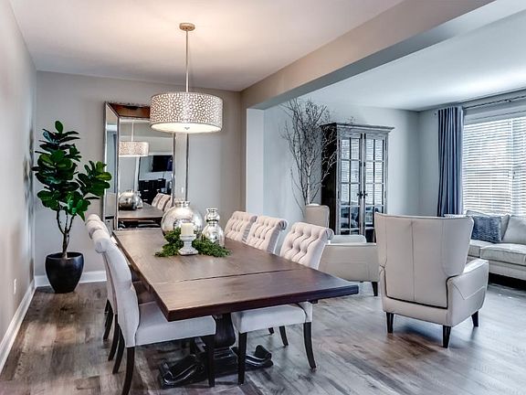 Gorgeous Dining Room big enough for the largest of family.  Beautiful Grey Toned Hardwood Floors