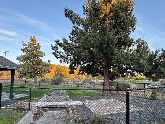 View of back patio and fenced yard.