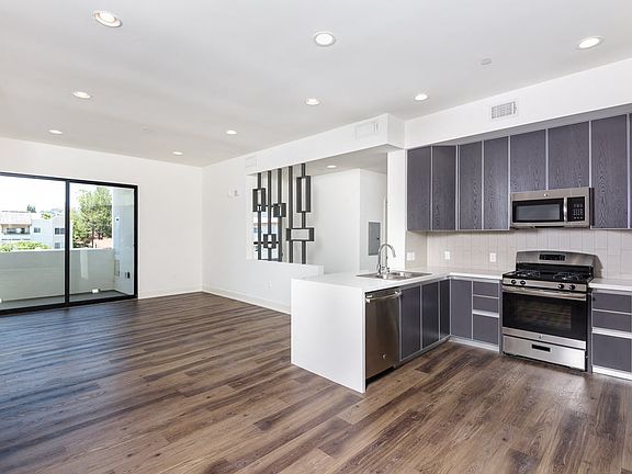 Open-Concept Kitchen, Dining, and Living Room Spaces