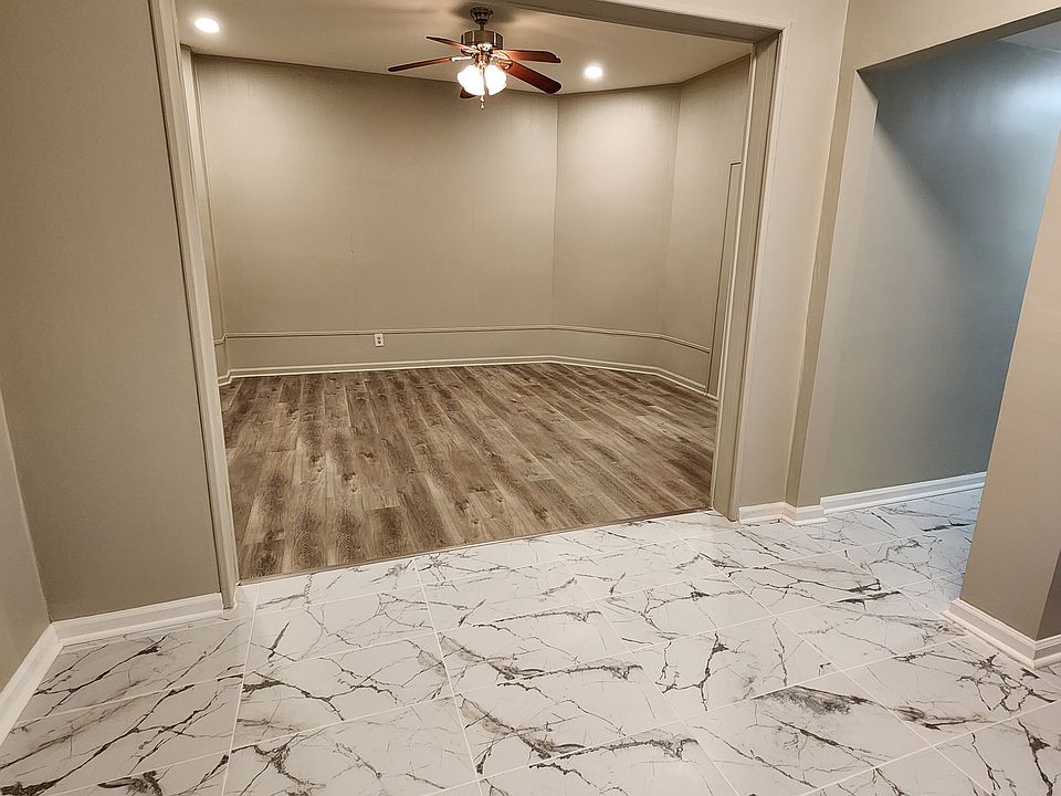 Stone kitchen floors leading to living rm.