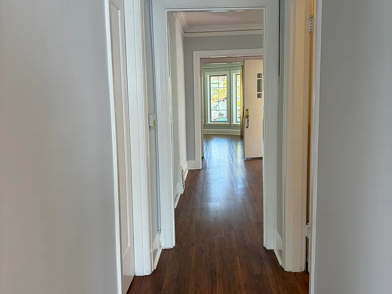 Hallway connects the bedroom area to the public areas of the house.