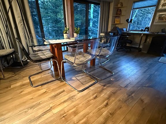 Dining room showing laminate flooring throughout the house.