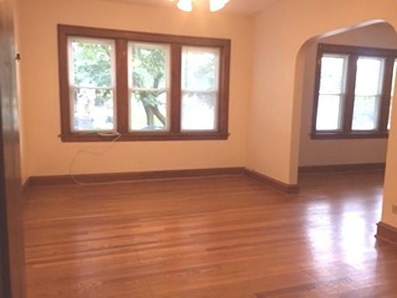 Living room connects with a family room/dining room with Fireplace and shelving