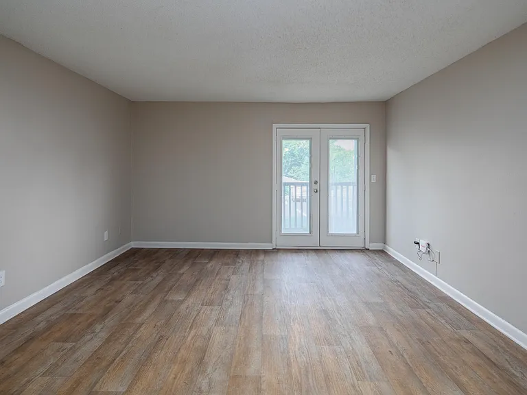 Spacious living room with hardwood-style flooring