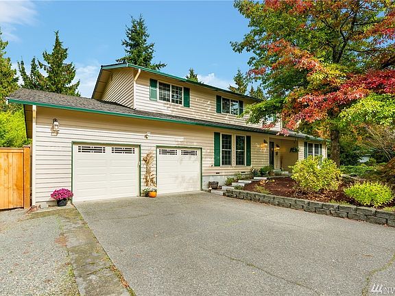 Front of home with RV parking. 3 car tandem garage