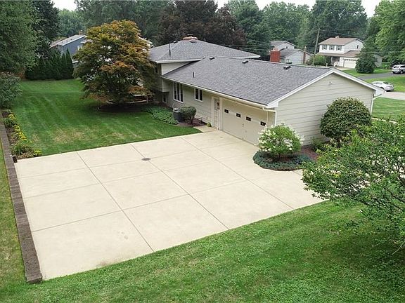 Large Cement Drive, and Level Back yard. Plenty of room to enjoy Family and Friends.