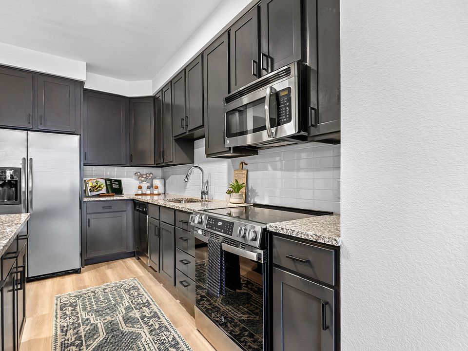 Upgraded kitchens with updated shaker style cabinets with sleek black hardware