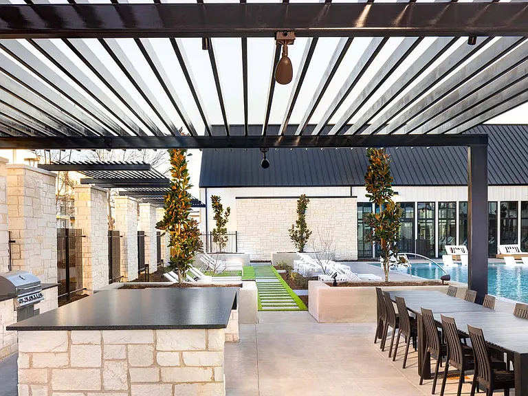 Host a barbecue or casual gathering in the outdoor kitchen and dining area, equipped for entertaining.