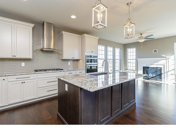 Kitchen with breakfast bar, stainless appliances and granite counter tops