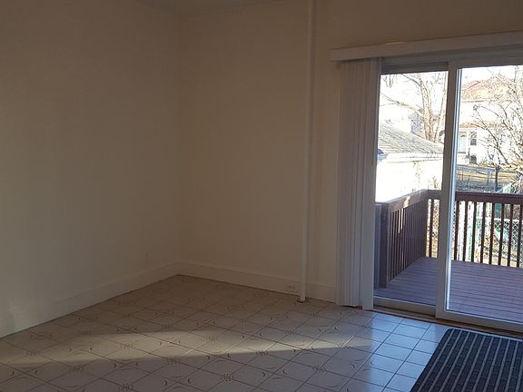 Living room (11' x 11') with sliding door to deck