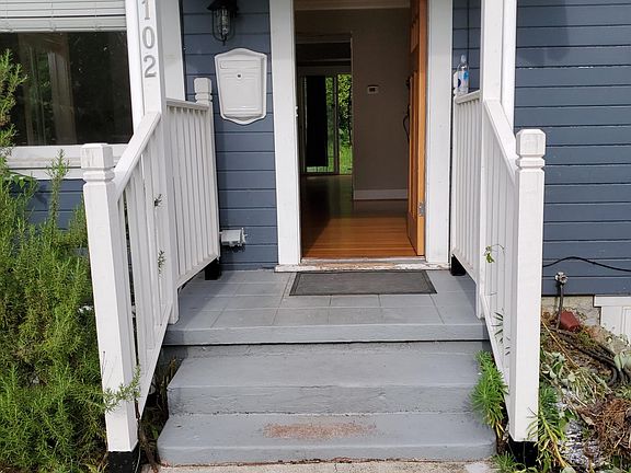 Looking through the front door, straight back through the unit to the sliding glass door that opens onto the backyard.