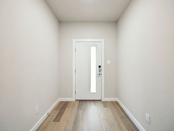 Entryway in the Oscar home plan by Trophy Signature Homes - REPRESENTATIVE PHOTO