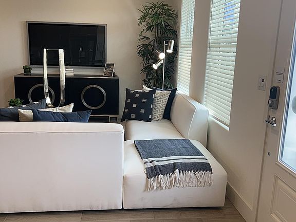 Spacious and bright living room (model home picture provided for reference along with the actual home)