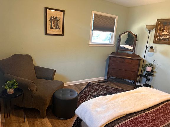 Main bedroom with seating and dresser
