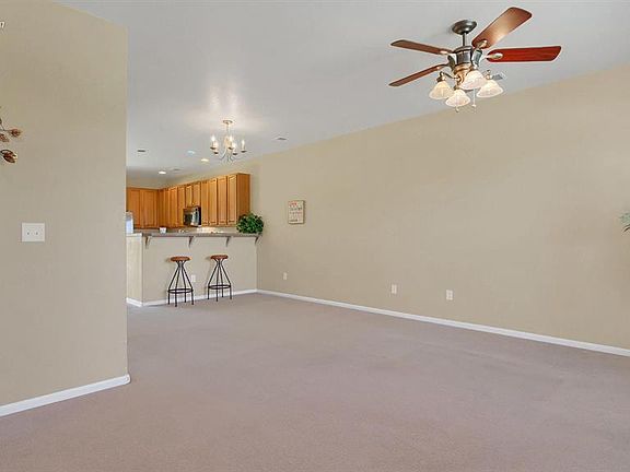 Bright and airy living room/dining room area with large windows!