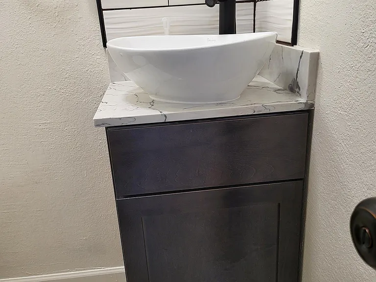 Second Bathroom __ with a stylish top sink.