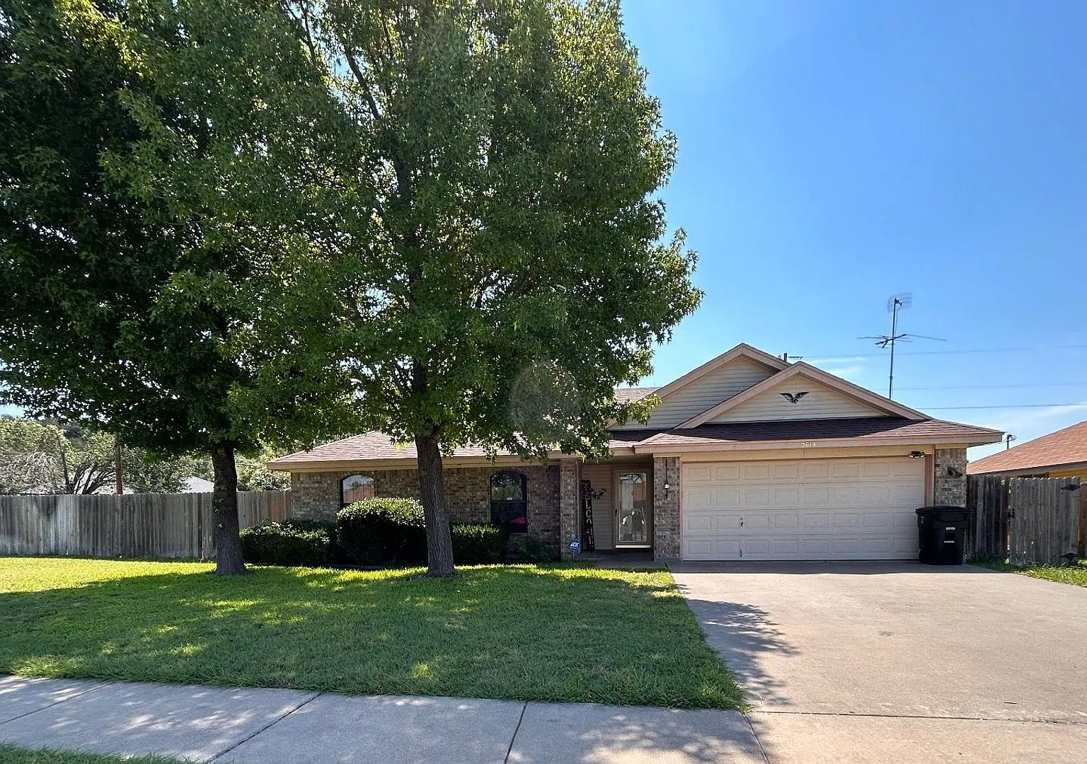 Available 11/12/26 Four bedroom on corner lot with St. Augustine grass and irrigation system! — Photo 1